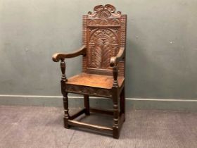 A 17th century style oak wainscot armchair 126 x 65 x 55cm