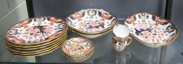 A Royal Crown Derby imari service, comprising six plates, two shell shaped dishes and two lozenge