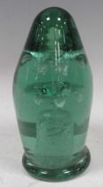 A Victorian green glass dump paper weight with flower inclusion 15cm high