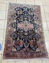 A red ground Afghan rug with figures to the border, 250 x 151cm, another Afghan rug, 158 x 105cm,