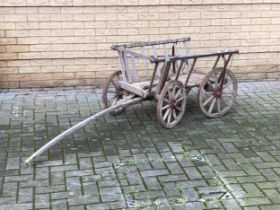 A 20th century teak dog cart, 62 x 90 x 70cm Provenance: Heydon Grange, Norfolk