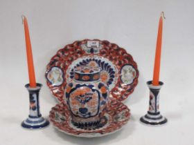 A pair of Continental Imari style candlesticks 13cm high together with a Imari style lidded ginger