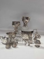 A collection of silverware including cruets, milk jug, sugar bowl, pin trays etc, 35.6ozt