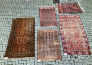 Five Beluchi / Afgan rugs, 210 x 117cm, 149 x 98cm, 212 x 119cm, 158 x 86cm, and 144 x 94cm (5)