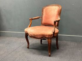 A French walnut Louis XV style fauteuil armchair, with moulded show frame on cabriole legs 84 x 65 x