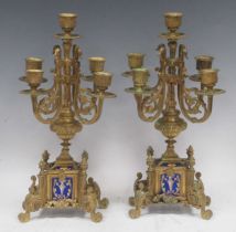 A pair of Continental gilt brass and ceramic candelabra, 36cm high (2)