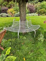 A wrought metal silver painted tree bench on scrolled feet 80cm high and 174cm wide the bench is