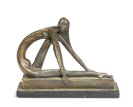 An Art Deco style bronzed resin model of a seated nude lady,