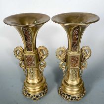 A pair of Gu style bronze vases, French, 19th century, imitating Chinese gu, with engraved