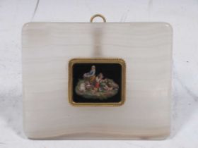 A 19th century micromosaic depicting a shepherd and shepherdess, set in an alabaster and gilt frame,