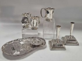 A collection of silver including 3 table cigarette boxes, a pair of candlesticks, a cream jug, small