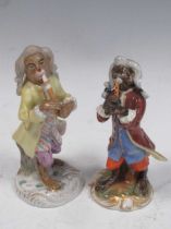 A Berlin monkey band figure and a continental porcelain monkey band figure, tallest 13cm high