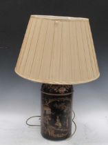 A black chinoiserie toleware lamp, in the form of a canister, 73cm including fittings Provenance: