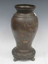 An early 20th century Japanese bronze lamp base inlaid in coloured metals with birds amidst