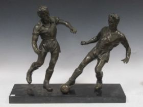 A bronze model of two football players, 62 x 50cm