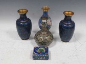 A pair of blue ground cloisonne vases together with another one decorated with white lilies, a small