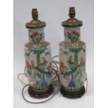 Two Chinese famille rose ceramic lamp bases, 46cm high Provenance: Heydon Grange, Norfolk Both vases
