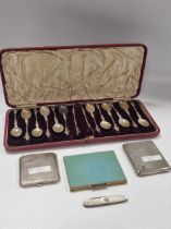 A silver cigarette case, a silver compact, a silver and mother of pearl fruit knife and a cased