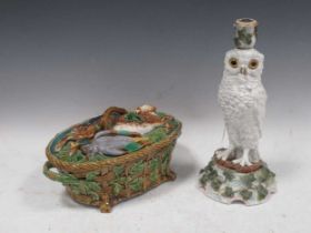 A Minton majolica game pie dish; together with a ceramic snowy owl candlestick, 32cm high