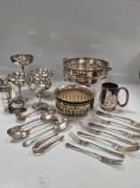 A collection of silverplated items including flatware, teapot, entrée dishes, champagne saucers etc