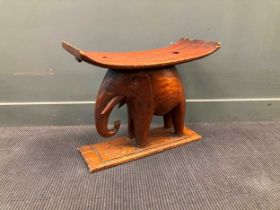 An African carved elephant stool 49 x 59 x 28cm