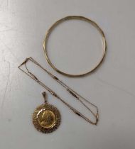 A Victoria 'Old Head' sovereign in a 9ct pendant mount and a 9ct arm bangle, 38.2g gross together
