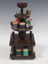 A 19th century yewwood cotton bobbin stand with turned support, 13cm high