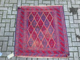 A Persian blue ground rug, with repeating lozenge field, 110 x 116cm