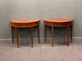 A pair of George III style mahogany demi-lune side tables on square tapered legs and spade feet 72 x