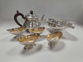 A silver teapot, a set of four silver salts and a sugar bowl stamped 'Sterling', 29.9ozt gross