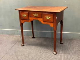 An 18th century oak and elm lowboy 76 x 85.5 x 49cm