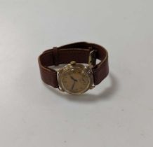 An unsigned mid-century 9ct gold wristwatch on a leather strap