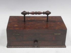 A 19th century rosewood portable writing box, the raised turned handle over twin hinged compartments