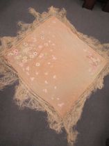 A Chinese silk embroidered peach coloured shawl early 20th century