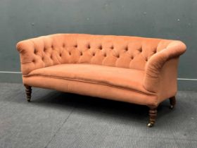 An Edwardian button back chesterfield type sofa, rear leg stamped 'GREGORY & CO' 66 x 160 x 80cm