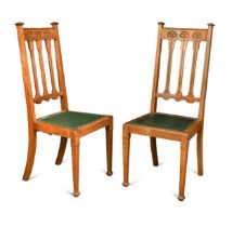 A pair of Arts & Crafts oak side chairs, retailed by Jas Shoolbred,