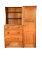 A Cotswold school oak combination wardrobe designed by Peter Waals,