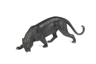 A dark patinated model of a prowling panther,