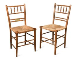 A pair of Sussex chairs of Royal interest,