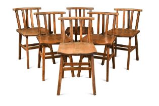 In the manner of Arthur Romney Green, a set of six oak stick back chairs,