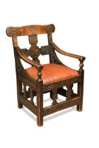 A Scandinavian carved oak chair, possibly retailed by Liberty, circa 1900,