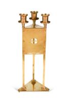 A Secessionist-style brass triform candlestick,