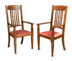 Attributed to Shapland & Petter, a pair of Arts & Crafts oversized oak armchairs, circa 1900,