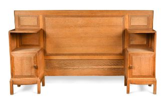 Paul Matt for Brynmawr Furniture, a golden oak single bed head, circa 1930,