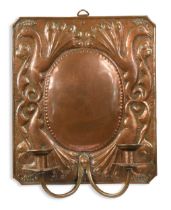 Attributed to John Pearson, an Arts & Crafts copper twin-branch wall sconce,