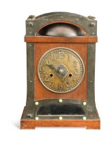 An Arts & Crafts oak mantle clock, probably retailed by Liberty & Co.,