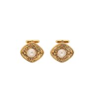 Chanel - A pair of arabesque cufflinks,