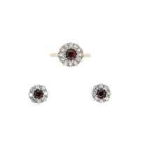 A garnet and diamond cluster ring, together with a pair of cluster ear studs,
