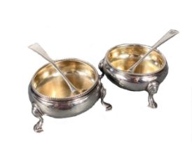 A pair of George III 18th century silver cauldron salts with two others and associated spoons,