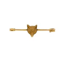 A fox head stock pin brooch,